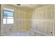 Unfinished bedroom with a large window offering natural light and a view of the outdoors at 15709 W Beryl Ave, Waddell, AZ 85355