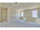 Unfinished room featuring drywall, two windows, and potential for customization at 15709 W Beryl Ave, Waddell, AZ 85355
