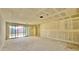 Unfinished living room with sliding glass doors, offering a bright and spacious area at 15709 W Beryl Ave, Waddell, AZ 85355