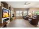 Bright living room showcases fireplace, plantation shutters, and cozy leather seating at 16800 E El Lago Blvd # 1038, Fountain Hills, AZ 85268