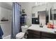 Bathroom showcasing a vanity, toilet, shower, and modern fixtures at 18040 W Louise Dr, Surprise, AZ 85387