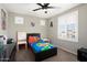 Vibrant bedroom with a dark bed frame and colorful decor, perfect for a playful and cheerful space at 18040 W Louise Dr, Surprise, AZ 85387