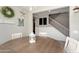Inviting dining room featuring a round wooden table, white chairs, and charming decor at 18040 W Louise Dr, Surprise, AZ 85387