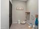 This pet-friendly room features a pet bed, dog accessories, and stylish decor at 18040 W Louise Dr, Surprise, AZ 85387