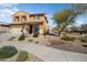 Inviting front yard with desert landscaping, a sidewalk, and an American flag at 18040 W Louise Dr, Surprise, AZ 85387