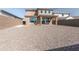 Expansive backyard that features a patio, a rear yard fence and desert landscaping at 19801 W Badgett Ln, Litchfield Park, AZ 85340