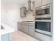 Close-up of the modern kitchen appliances including the stainless steel oven, microwave and cooktop at 19801 W Badgett Ln, Litchfield Park, AZ 85340