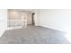 Upstairs living room featuring neutral walls and plush gray carpeting at 19801 W Badgett Ln, Litchfield Park, AZ 85340
