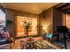 Covered patio with sliding glass doors, outdoor furniture, rug, and grill for outdoor relaxation at 19975 N Crescent Way, Surprise, AZ 85374