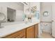 Bathroom with light wood cabinets, tan walls and a white countertop at 19975 N Crescent Way, Surprise, AZ 85374