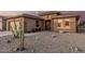 Charming home with desert landscaping and a large saguaro cactus in the front yard at 19975 N Crescent Way, Surprise, AZ 85374