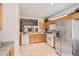Modern kitchen featuring stainless steel appliances and ample cabinet space at 19975 N Crescent Way, Surprise, AZ 85374