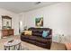 Cozy living room with comfortable leather sofa, stylish decor, and ample natural light at 19975 N Crescent Way, Surprise, AZ 85374
