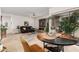 Open-concept living and dining area with plenty of natural light and comfortable seating at 19975 N Crescent Way, Surprise, AZ 85374