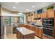 Bright kitchen with island, stainless steel appliances, and plenty of cabinet space at 20139 N Rawhide Way, Surprise, AZ 85387