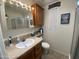 Bathroom sink and vanity cabinet with fixtures at 2070 W Klamath Ave, Apache Junction, AZ 85119