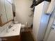 Bathroom with cabinet, toilet, and fixtures at 2070 W Klamath Ave, Apache Junction, AZ 85119