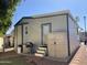 Home exterior featuring a grill, outdoor storage, and easy access, perfect for outdoor relaxation at 2070 W Klamath Ave, Apache Junction, AZ 85119