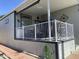 Home exterior showcasing a welcoming porch, white railing, and manicured landscaping, enhancing curb appeal at 2070 W Klamath Ave, Apache Junction, AZ 85119