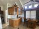 Inviting kitchen with custom wooden cabinetry, eat-in dining, and plenty of counter space at 2070 W Klamath Ave, Apache Junction, AZ 85119