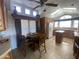 Bright kitchen featuring wooden cabinets, a cozy dining area, and modern appliances at 2070 W Klamath Ave, Apache Junction, AZ 85119