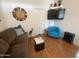 Comfortable living room with a large sofa, decorative elements, and a cozy atmosphere at 2070 W Klamath Ave, Apache Junction, AZ 85119