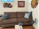 A comfortable sofa accented with throw pillows in a cozy living room setup at 2070 W Klamath Ave, Apache Junction, AZ 85119