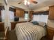 Bedroom featuring cabinets, window, and comfortable bed at 2070 W Klamath Ave, Apache Junction, AZ 85119