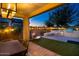 Outdoor patio features a dining area and lounging space with built in BBQ, perfect for entertaining at 20906 E Macaw Dr, Queen Creek, AZ 85142