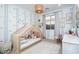 Cozy bedroom features a daybed and decorative wall decals at 20906 E Macaw Dr, Queen Creek, AZ 85142