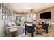 Cozy living area with a sectional sofa, modern decor, and large windows with natural light at 20906 E Macaw Dr, Queen Creek, AZ 85142