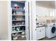 Well-organized pantry with shelving and storage solutions adjacent to the laundry room at 20906 E Macaw Dr, Queen Creek, AZ 85142