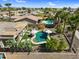 Wide aerial view featuring a private backyard with a pool, lounge chairs, and a covered patio at 21141 E Stirrup St, Queen Creek, AZ 85142