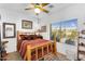 Charming bedroom with a rustic wooden bed frame, bedside table, and natural lighting at 21141 E Stirrup St, Queen Creek, AZ 85142