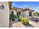 Attractive home featuring desert landscaping and a welcoming entrance way at 21141 E Stirrup St, Queen Creek, AZ 85142