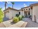 Charming single-story home with desert landscaping, a two-car garage, and a decorative front door at 21141 E Stirrup St, Queen Creek, AZ 85142
