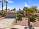 Charming single-story home with mature landscaping, desert plants, and large driveway at 21141 E Stirrup St, Queen Creek, AZ 85142