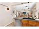 Open concept Kitchen with wood cabinetry, granite counters and stainless steel appliances at 21141 E Stirrup St, Queen Creek, AZ 85142