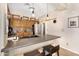 Kitchen with dark countertops, stainless steel appliances, and wooden cabinets at 21141 E Stirrup St, Queen Creek, AZ 85142