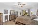 Comfortable main bedroom with a view of the landscaped backyard and decorative furniture at 21141 E Stirrup St, Queen Creek, AZ 85142