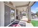 A cozy outdoor dining area adjacent to the house creates a welcoming space for entertaining at 21141 E Stirrup St, Queen Creek, AZ 85142