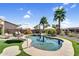 Private backyard pool and spa with manicured landscaping and covered patio seating at 21141 E Stirrup St, Queen Creek, AZ 85142