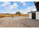 Spacious backyard featuring a new wooden fence, desert landscaping, and a small patio at 2161 E Corona Ave, Phoenix, AZ 85040