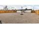 Expansive backyard features desert landscaping, a new fence, and mature trees at 2161 E Corona Ave, Phoenix, AZ 85040