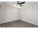 Light and airy bedroom features wood-look floors, a ceiling fan, and natural light at 2161 E Corona Ave, Phoenix, AZ 85040