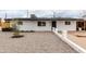 Charming single-story home with a well-maintained gravel yard and freshly painted white exterior at 2161 E Corona Ave, Phoenix, AZ 85040