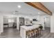 Contemporary kitchen with stainless steel appliances, an island cooktop, and white cabinetry at 2161 E Corona Ave, Phoenix, AZ 85040