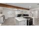 Modern open kitchen with stainless steel appliances and a view of the living area at 2161 E Corona Ave, Phoenix, AZ 85040