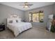 Bedroom with large window, neutral tones and carpet flooring at 2544 W Pumpkin Ridge Dr, Anthem, AZ 85086