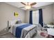 Bedroom with large window, blue accents and dual workstations at 2544 W Pumpkin Ridge Dr, Anthem, AZ 85086